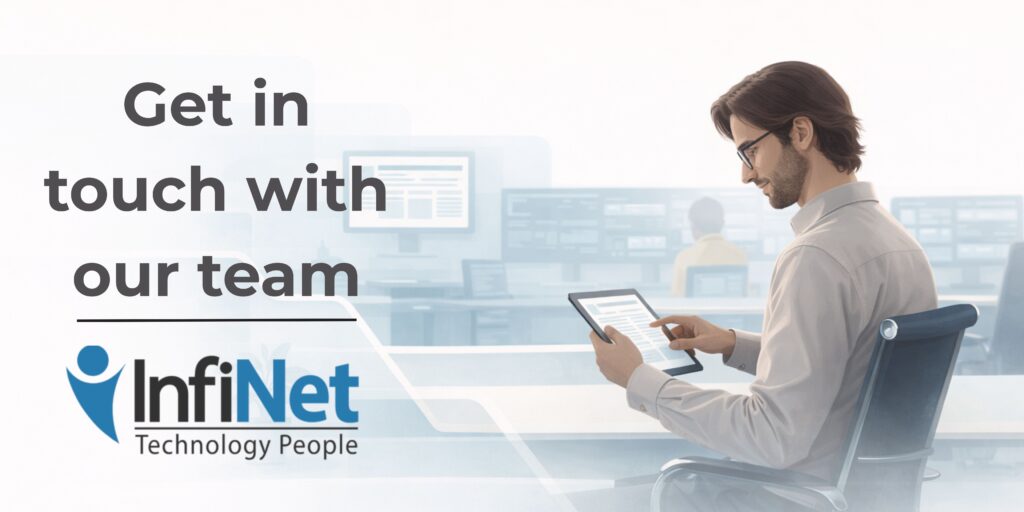 Flat-style illustration of a seated male professional using a digital tablet in an IT operations center. The background shows multiple system monitors and other staff at work. Branding includes the message “Get in touch with our team” and the InfiNet logo.